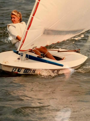 Teen girl on small sailing boat